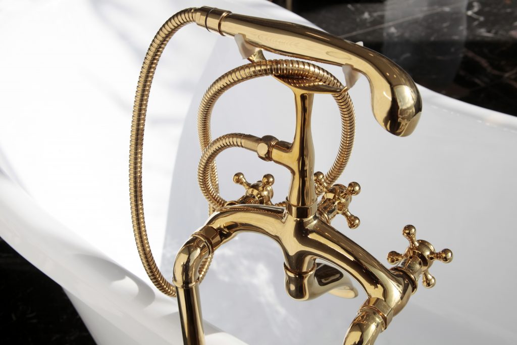 polished gold fixtures in bathtub