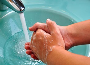 hands washing in faucet